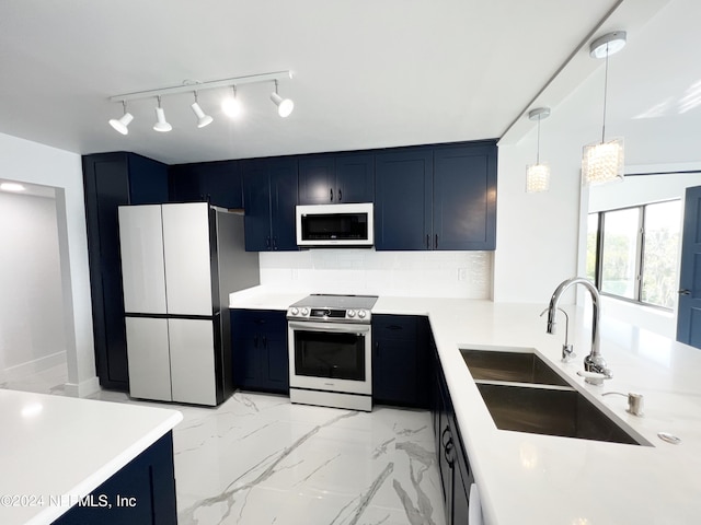 kitchen with stainless steel electric range, refrigerator, blue cabinetry, and sink