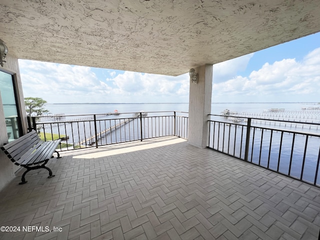 balcony featuring a water view