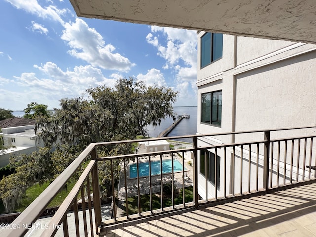 balcony featuring a water view