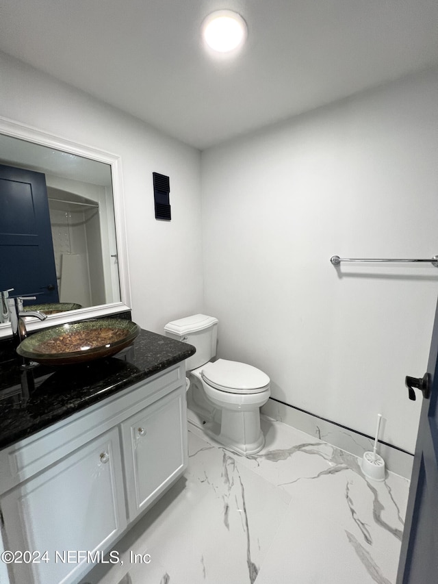 bathroom with vanity and toilet