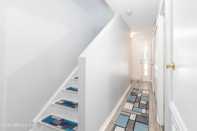 stairway with wood-type flooring