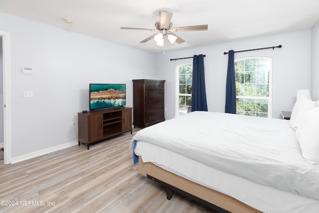 bedroom featuring ceiling fan and light hardwood / wood-style flooring