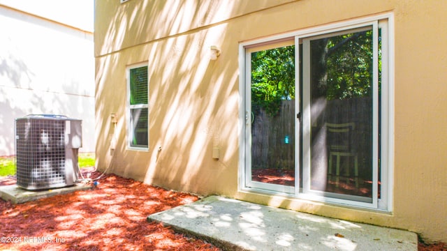 exterior space featuring cooling unit and a patio