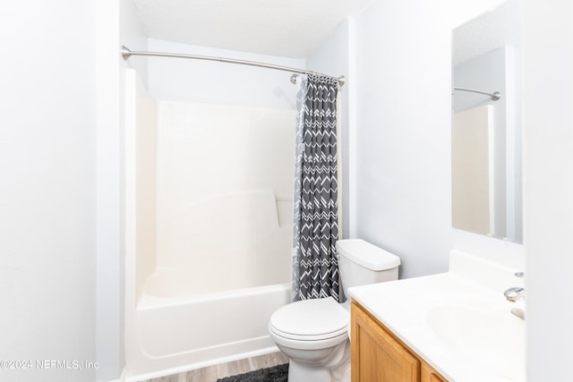 full bathroom featuring wood-type flooring, vanity, toilet, and shower / bath combination with curtain