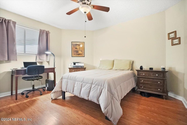 bedroom featuring ceiling fan and hardwood / wood-style flooring