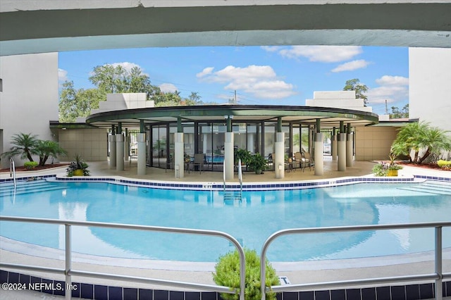 view of swimming pool with a patio area