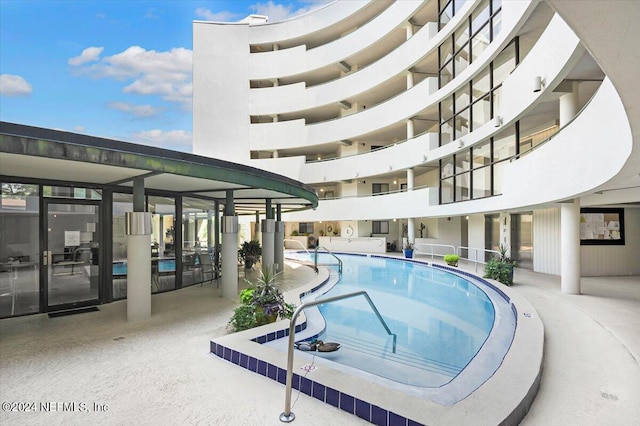 view of swimming pool featuring a patio