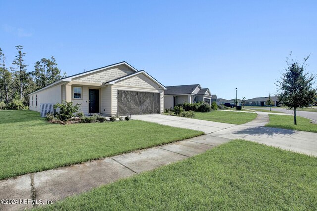 single story home with a front lawn and a garage