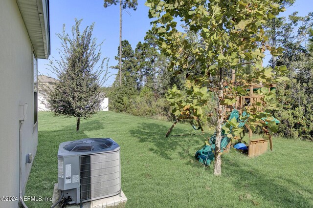 view of yard with central AC