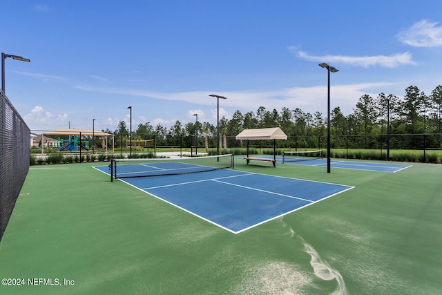 view of sport court with basketball hoop