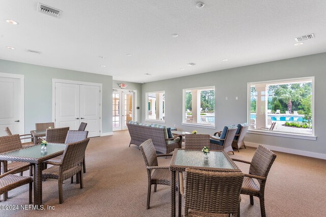 dining room with carpet and french doors