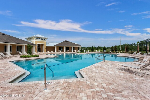 view of pool featuring a patio area