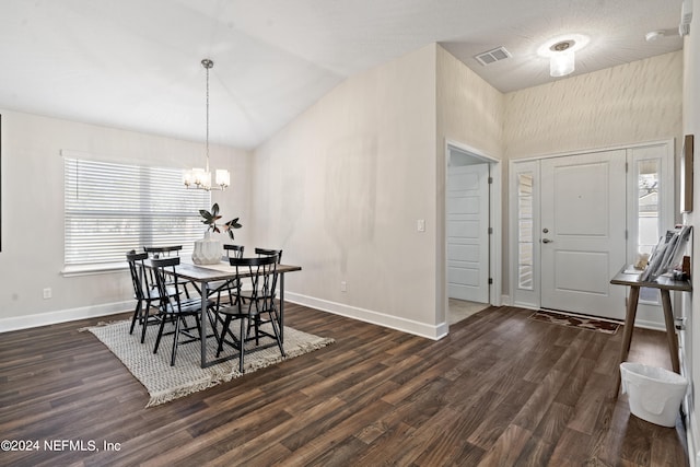 dining area with high vaulted ceiling, a chandelier, and dark wood-type flooring