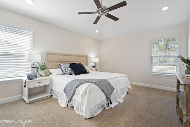 carpeted bedroom featuring ceiling fan