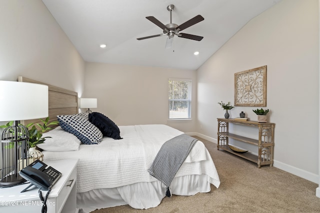 carpeted bedroom with ceiling fan and lofted ceiling