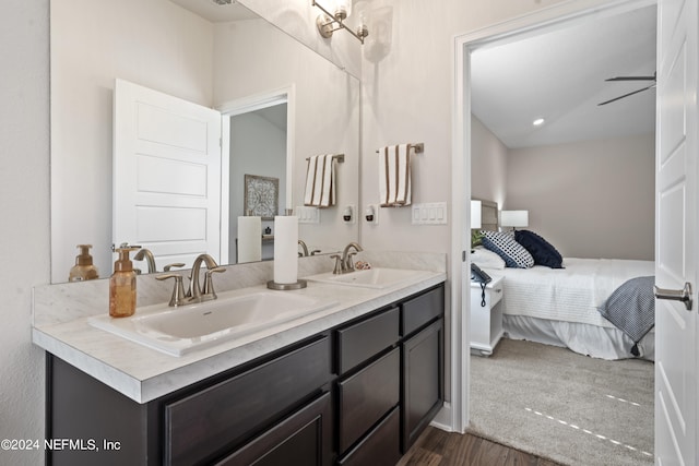 bathroom with vanity and hardwood / wood-style flooring