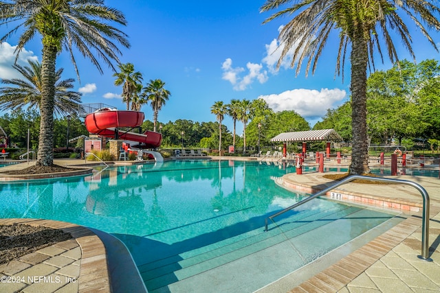 view of swimming pool featuring a water slide