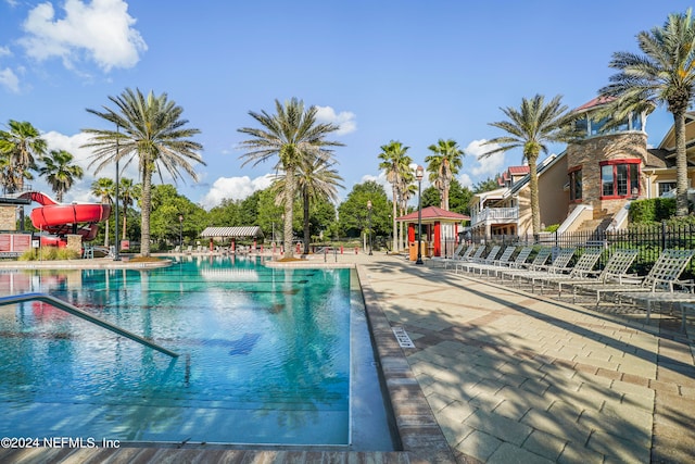 view of pool with a water slide