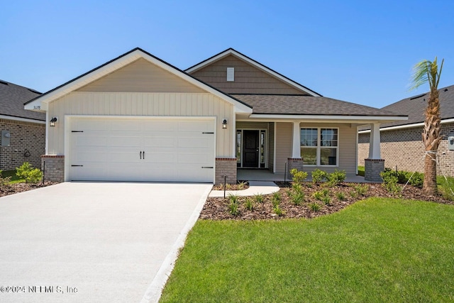 craftsman-style house with a front yard and a garage