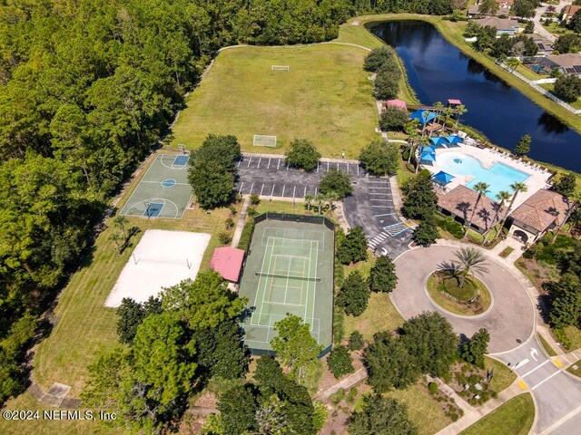 birds eye view of property with a water view