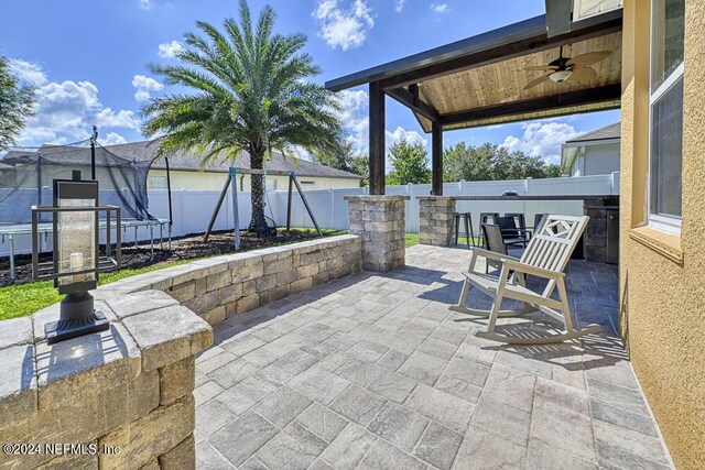 view of patio featuring ceiling fan