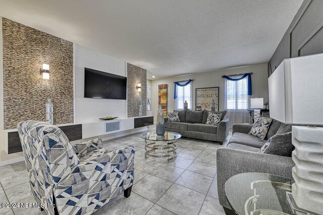 tiled living room with a textured ceiling