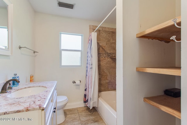 full bathroom featuring toilet, tile patterned flooring, vanity, and shower / tub combo