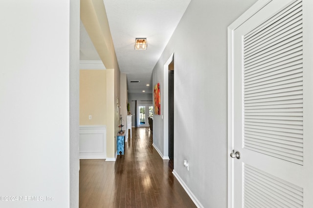 hallway with dark wood-type flooring