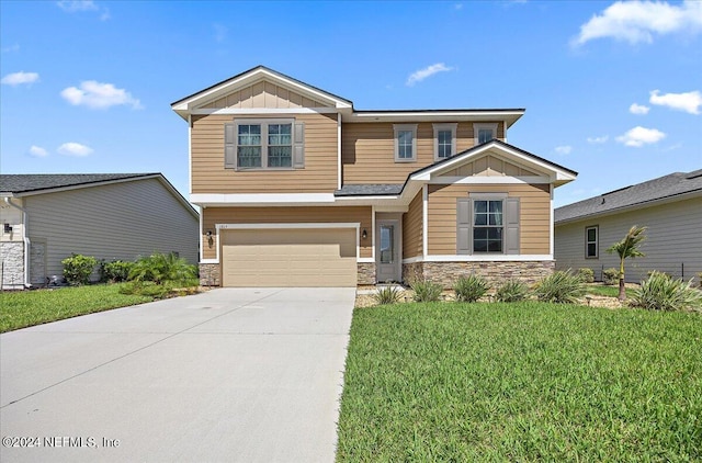 craftsman-style home with a front yard and a garage