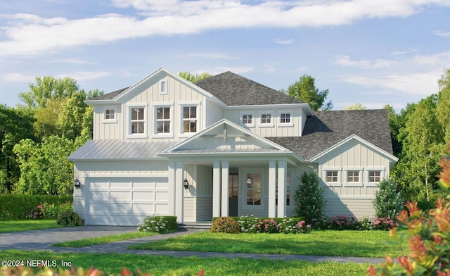 view of front facade with a garage and a front lawn