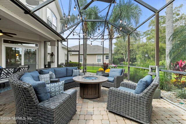 sunroom / solarium with ceiling fan