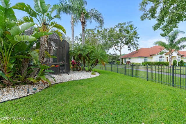 view of yard with a lanai