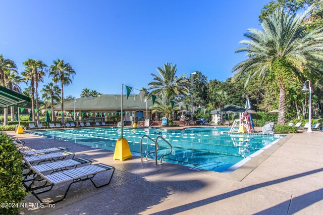 view of swimming pool featuring a patio