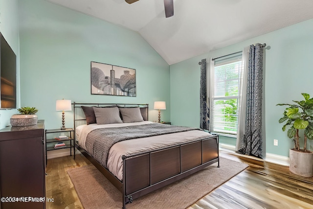 bedroom featuring wood-type flooring, lofted ceiling, and ceiling fan