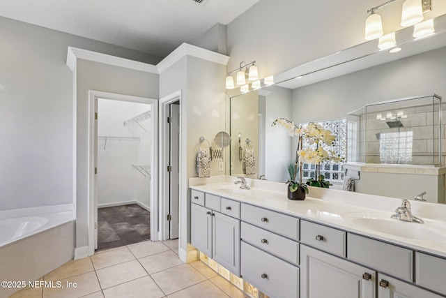 bathroom featuring tile patterned floors, vanity, and independent shower and bath