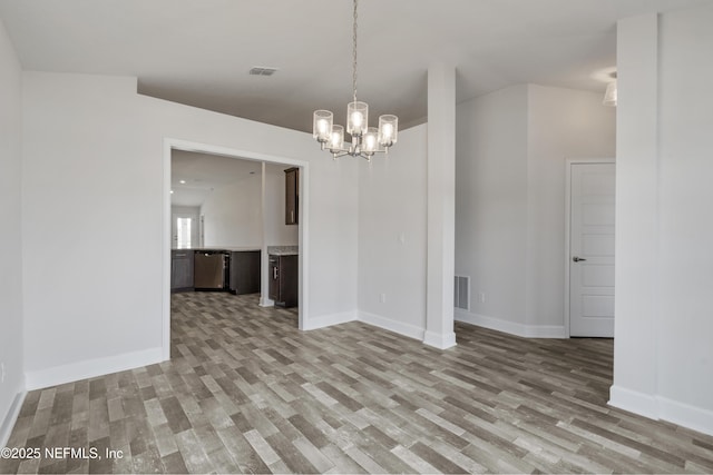 3145 Forest View Ln, Green Cove Springs, FL 32043 - unfurnished room with light wood-style flooring and a chandelier
