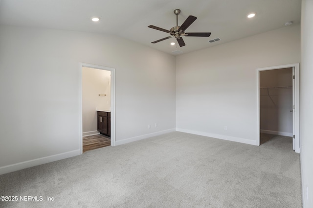 3145 Forest View Ln, Green Cove Springs, FL 32043 - unfurnished bedroom with carpet, a spacious closet, lofted ceiling, recessed lighting, and a closet