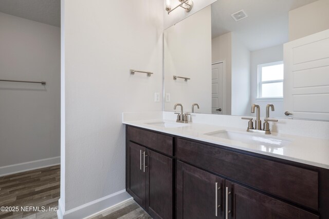 3145 Forest View Ln, Green Cove Springs, FL 32043 - bathroom with double vanity and wood finished floors