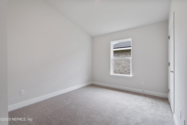 3145 Forest View Ln, Green Cove Springs, FL 32043 - empty room with carpet floors and vaulted ceiling