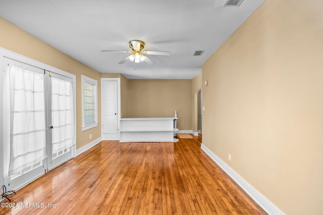 unfurnished room with light hardwood / wood-style flooring and ceiling fan