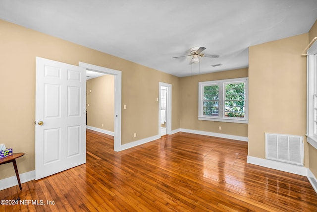 unfurnished room with ceiling fan and hardwood / wood-style floors