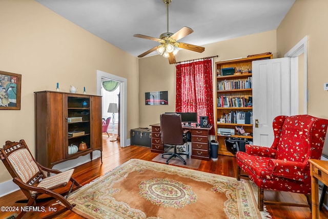 office space with hardwood / wood-style floors and ceiling fan