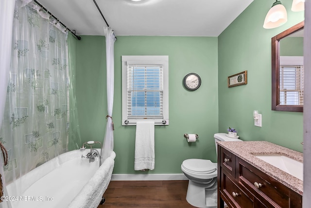 full bathroom featuring toilet, hardwood / wood-style flooring, vanity, and shower / bathtub combination with curtain