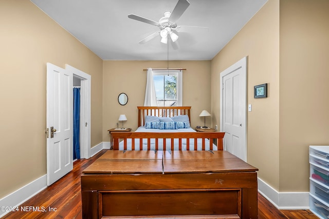 bedroom with dark wood-type flooring and ceiling fan