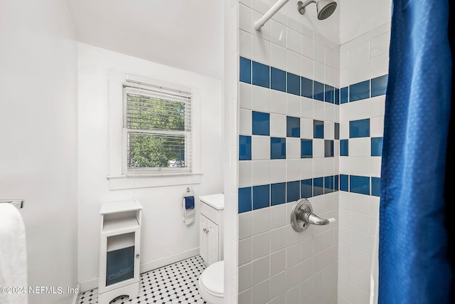 bathroom featuring toilet, a shower with curtain, and vanity