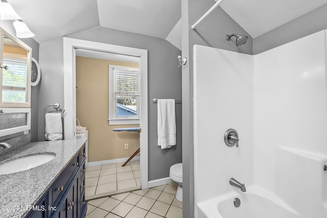 full bathroom with vanity, toilet, a healthy amount of sunlight, and vaulted ceiling