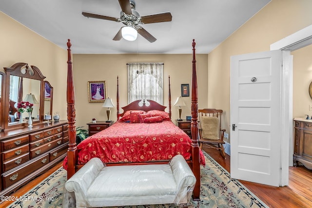 bedroom featuring wood-type flooring and ceiling fan