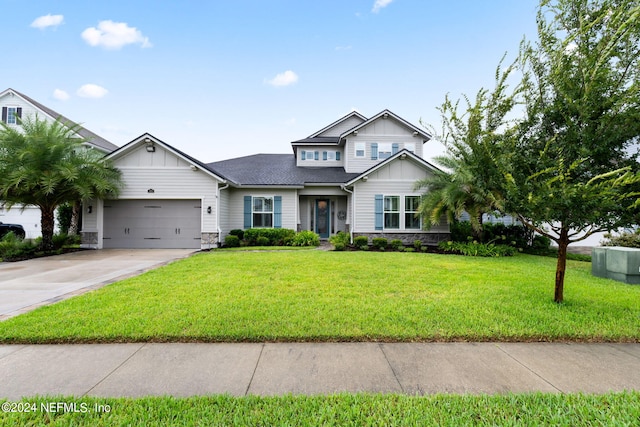 view of front of home featuring a front lawn and a garage