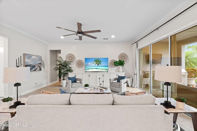 living room with ceiling fan, light hardwood / wood-style flooring, and crown molding