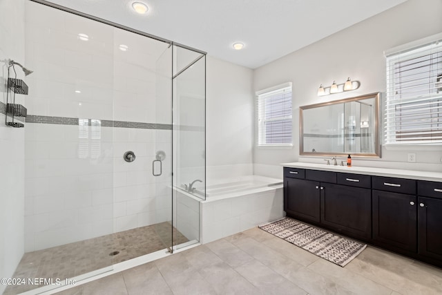 bathroom featuring vanity, tile patterned floors, and independent shower and bath